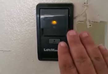 Inside garage view of repaired opener motor and remote receiver for San Bruno resident